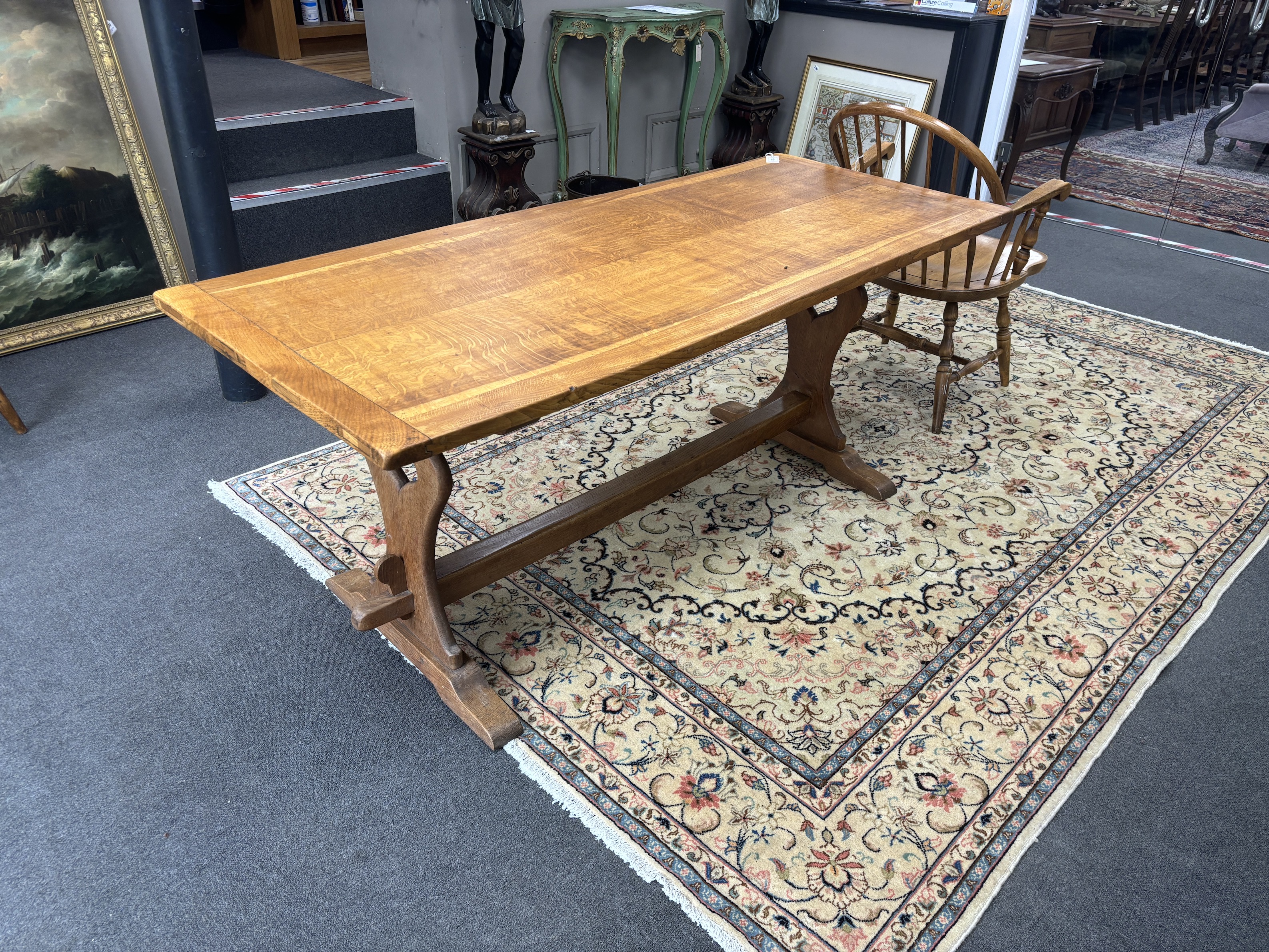 An Arts & Crafts style rectangular oak refectory dining table, width 175cm, depth 73cm, height 73cm